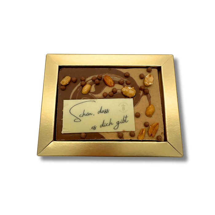 Gruß Schokolade Karamell-Vollmilch Erdnusspraline mit Erdnüssen und Crisp